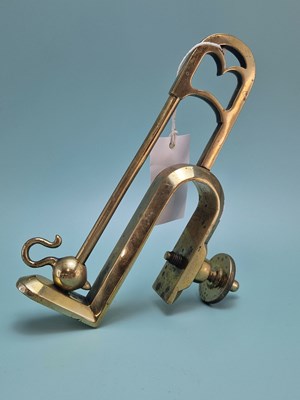 Lot 267 - A polished bronze meat jack holder together...