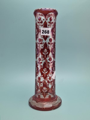 Lot 268 - A Bohemian ruby overlay glass cylindrical vase...