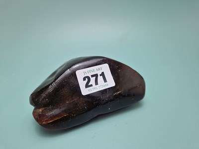 Lot 271 - A triangular pebble of amber.   W 11cms.