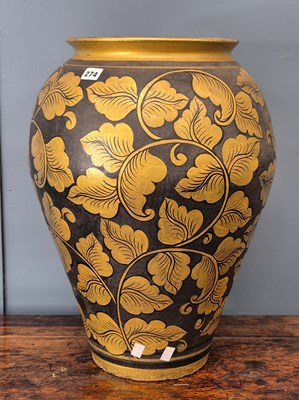 Lot 274 - A central Asian black ground ovoid vase gilt...