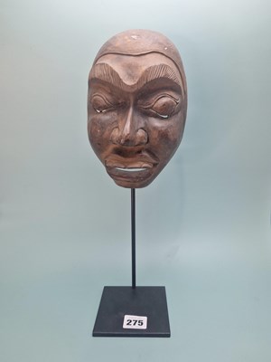 Lot 275 - An ethnic carved wood mask, possibly...