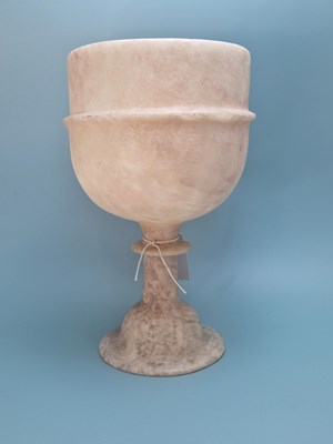 Lot 277 - An alabaster goblet shaped vase with an...