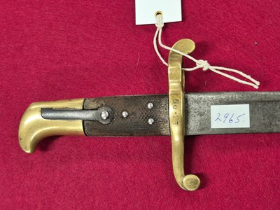 Lot 286 - A late 19th century British sword bayonet with...