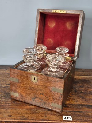 Lot 287 - A brass bound rosewood decanter box containing...