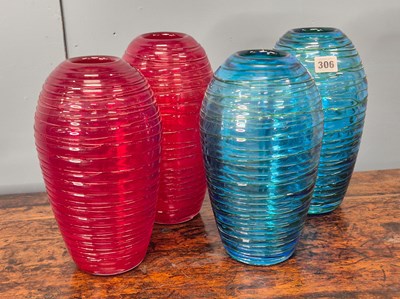 Lot 306 - A pair of studio glass red vases, the ovoid...