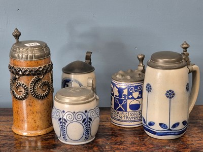 Lot 310 - Five various pewter lidded steins of which...