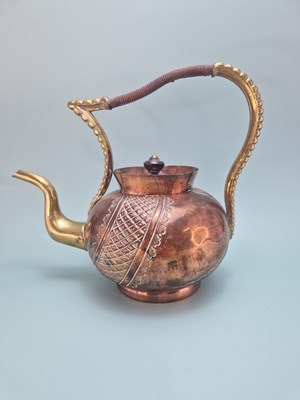 Lot 313 - An Arts and Crafts copper kettle with a brass...