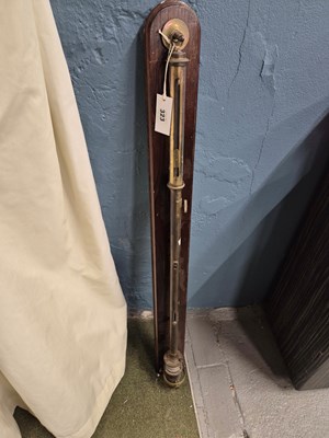 Lot 323 - A brass stick barometer mounted onto a wooden...