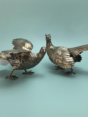 Lot 330 - A silver cock and hen pheasant by Freeman &...