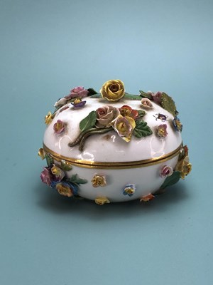 Lot 336 - A Meissen flower encrusted bun shaped box and...