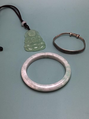 Lot 337 - A Chinese jadeite bangle, another in white...