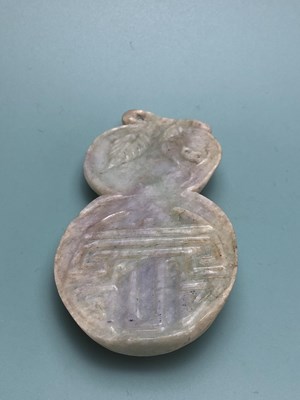 Lot 338 - A Chinese jadeite pendant, the double gourd...