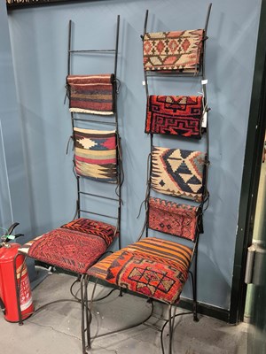 Lot 347 - A pair of Liberty's style iron chairs, the...