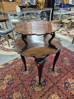 Lot 352 - A pair of mahogany two-tier tables, the...