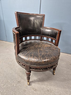 Lot 353 - A mahogany tub armchair, the leather...