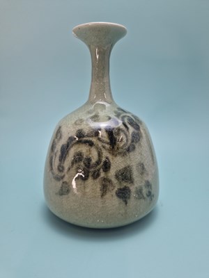 Lot 449 - An unmarked crackled celadon studio bottle...
