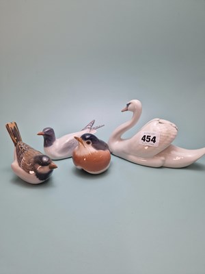 Lot 454 - Four Royal Copenhagen figures of birds: a wren,...