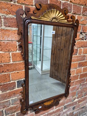 Lot 477 - A mahogany cut work mirror crested by a gilt...