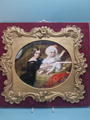 Lot 494 - Victorian school, a girl with her baby sibling,...