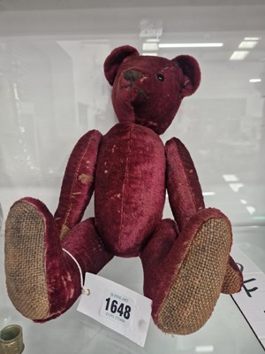 Lot 1648 - A purple plush teddy bear