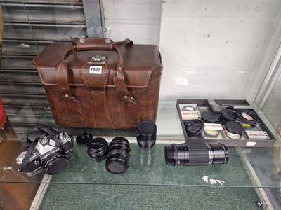 Lot 1675 - A Pentax MX camera, lenses, lens cases...