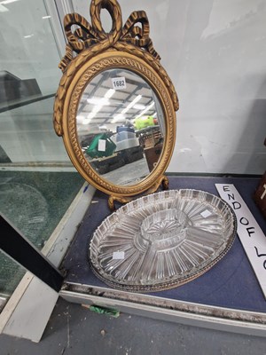 Lot 1682 - A gilt framed oval mirror together with a...