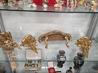 Lot 1687 - A pair and two other gilt wood wall brackets