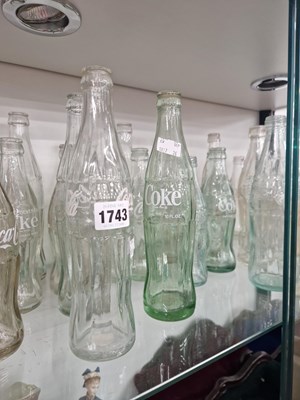 Lot 1743 - A collection of Coca Cola bottles
