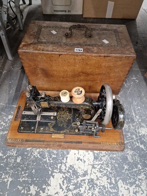 Lot 1784 - A wooden boxed Brister and Rossman sewing machine