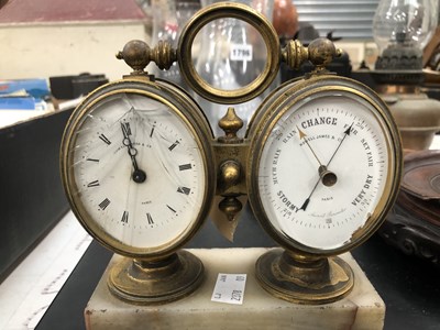 Lot 1796 - A combined clock and aneroid barometer, glass...