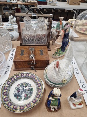 Lot 1818 - A two decanter tantalus, an oak cigar and...