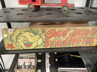 Lot 1842 - A green ground plywood sign featuring Popeye...