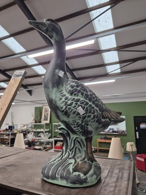Lot 1855 - A bronze patinated metal goose. H 59 W 4.5cms