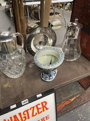 Lot 1857 - Two electroplate mounted glass jugs, an...