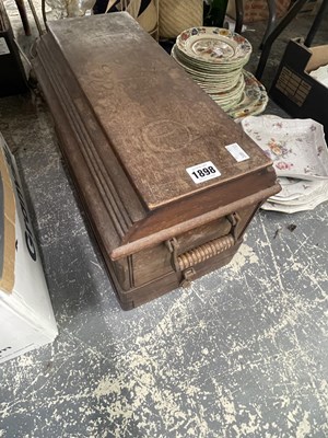 Lot 1898 - A wooden cased sewing machine