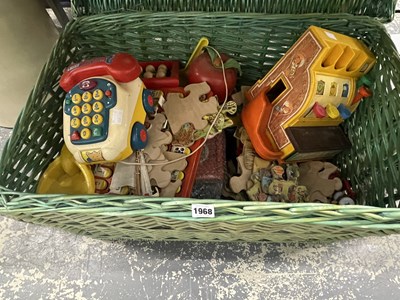 Lot 1968 - A basket of children's toys and puzzles