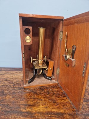 Lot 802 - A mahogany cased brass barreled microscope...