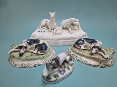 Lot 817 - A biscuit porcelain group of two greyhounds...