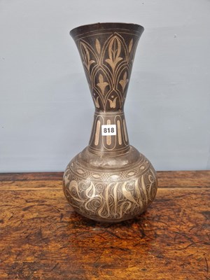 Lot 818 - A silver koftgari iron vase, the flared neck...