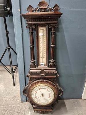Lot 841 - A Victorian oak cased aneroid barometer, the...