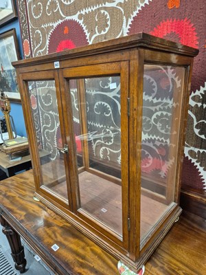 Lot 843 - A glazed mahogany shop display cabinet.   W 76...