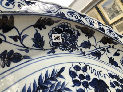Lot 845 - A Chinese blue and white dish on a folding...