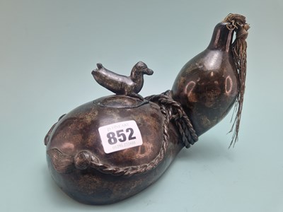 Lot 852 - A Japanese bronze oil lamp in the shape of a...