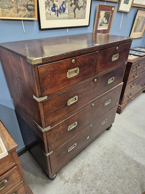 Lot 866 - A mahogany campaign chest of two short and...