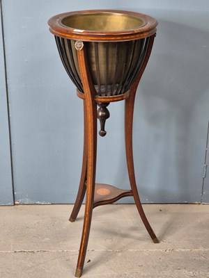 Lot 875 - An Edwardian mahogany planter table with a...