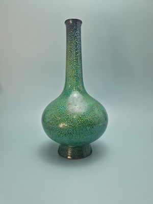 Lot 877 - A Ruskin style bottle vase with a high fired...