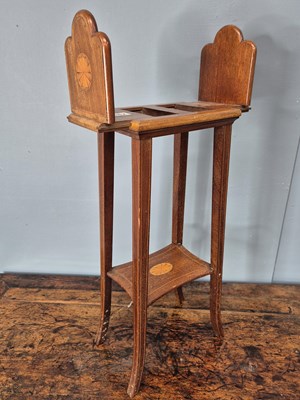Lot 882 - An Edwardian mahogany book slide table, the...