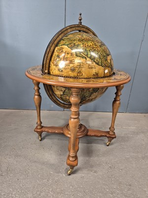 Lot 886 - A terrestial globe drinks cabinet printed...