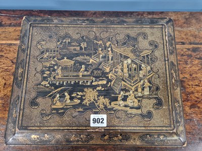 Lot 902 - A 19th century Chinese black lacquer games box,...