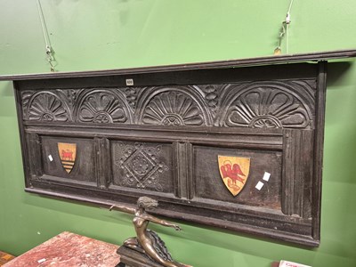 Lot 920 - An oak over mantle panel carved with four half...